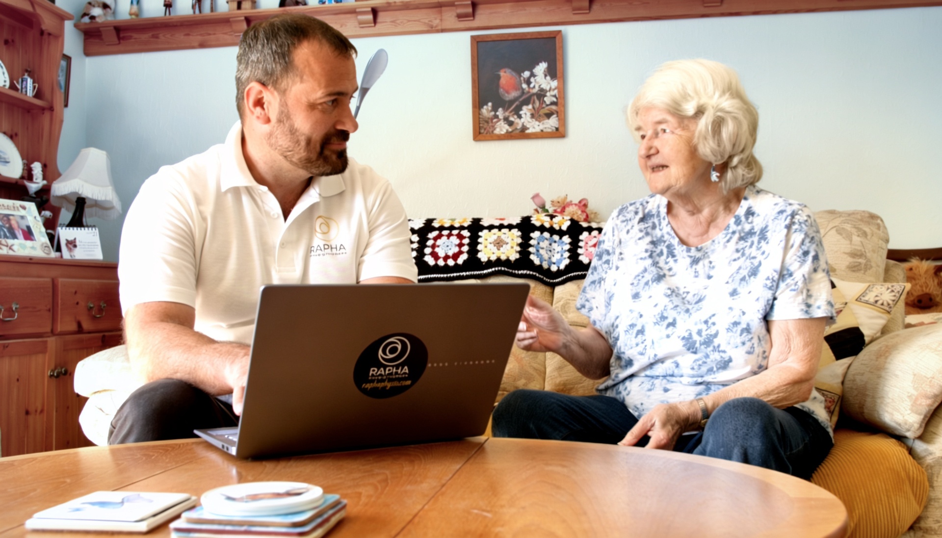 Physiotherapist consulting a patient at home